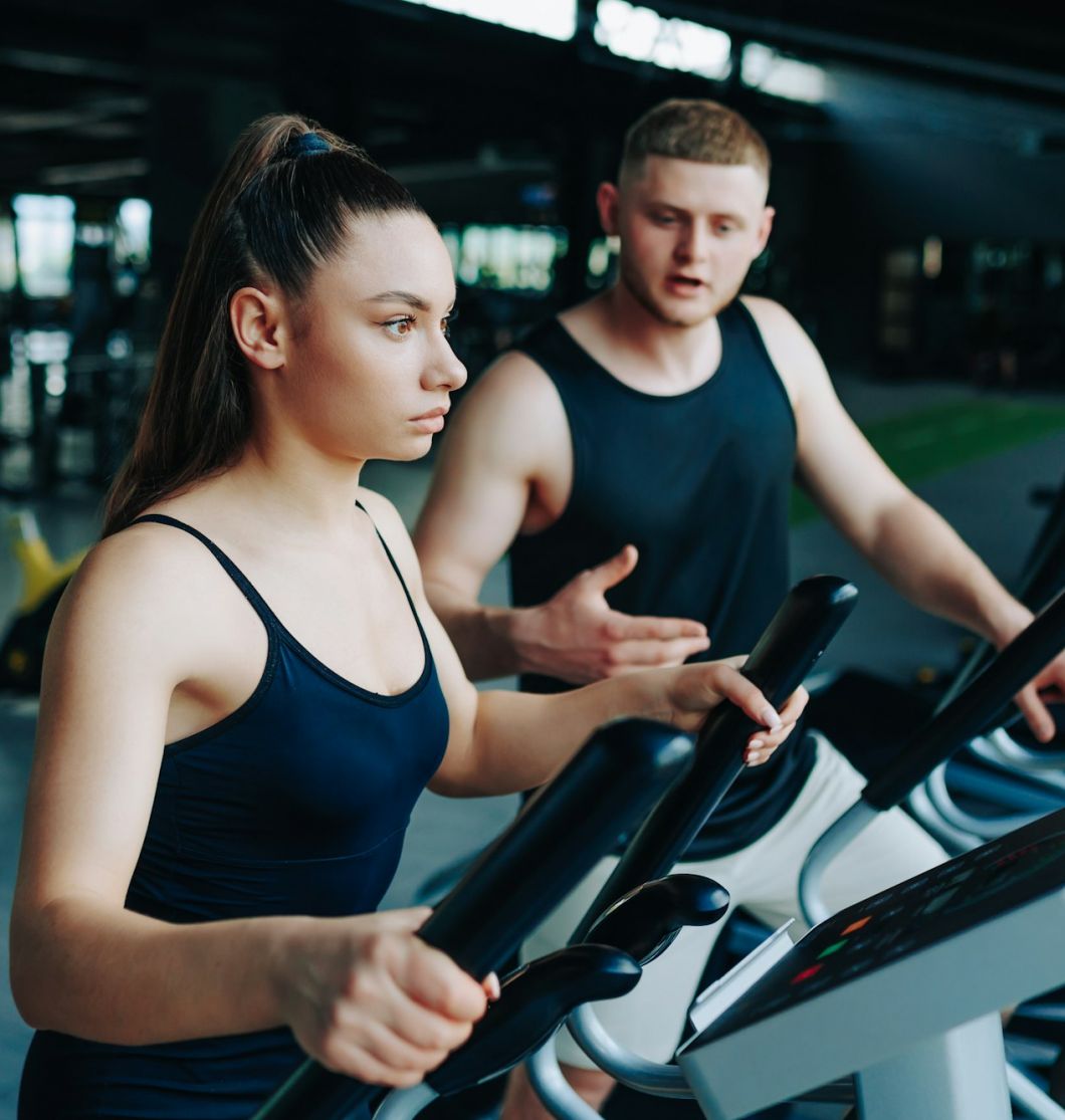 Fitness Trainer Guiding a Dynamic Workout Session at the Gym